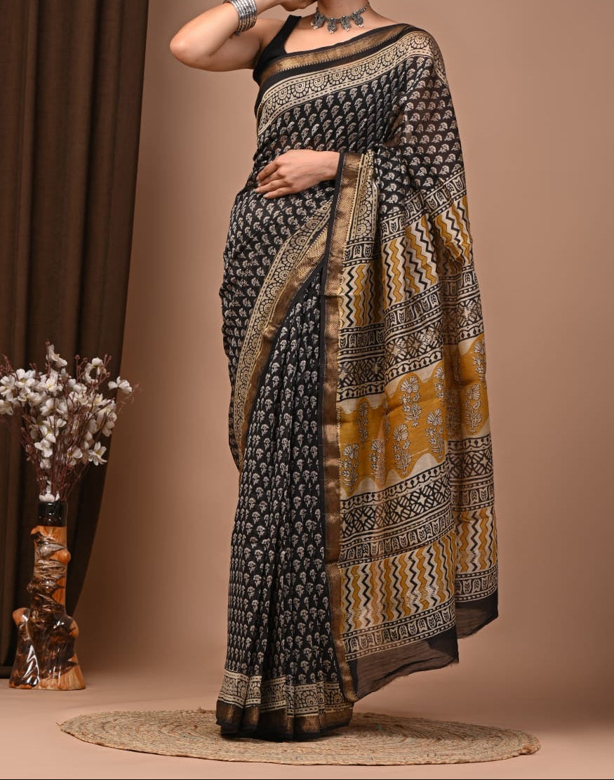 Maheshwari sik sarees Black floral motifs body geometric stripes, floral yellow and black motifs pallu, sleek zari border
