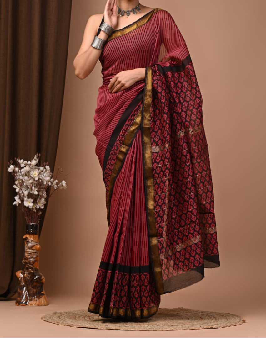 Maheshwari sik sarees Red saree with black motifs throughout the body, black and red geometric motifs pallu and border.
